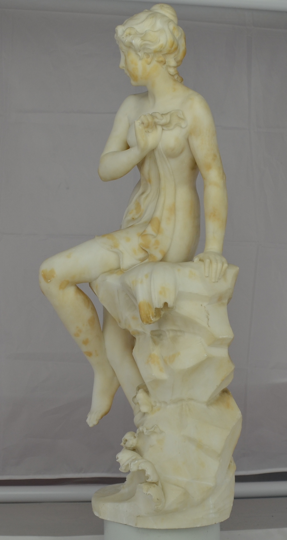 “Venus Perched On Rocks” Carrera Marble Sculpture After Eteinne-Maurice Falconet