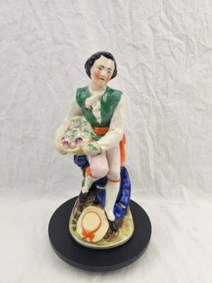 19th Century Staffordshire Figure Of A Seated Youth