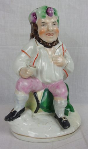 Mid 19th Century Staffordshire Figurine Of A Seated Gentleman Imbibing