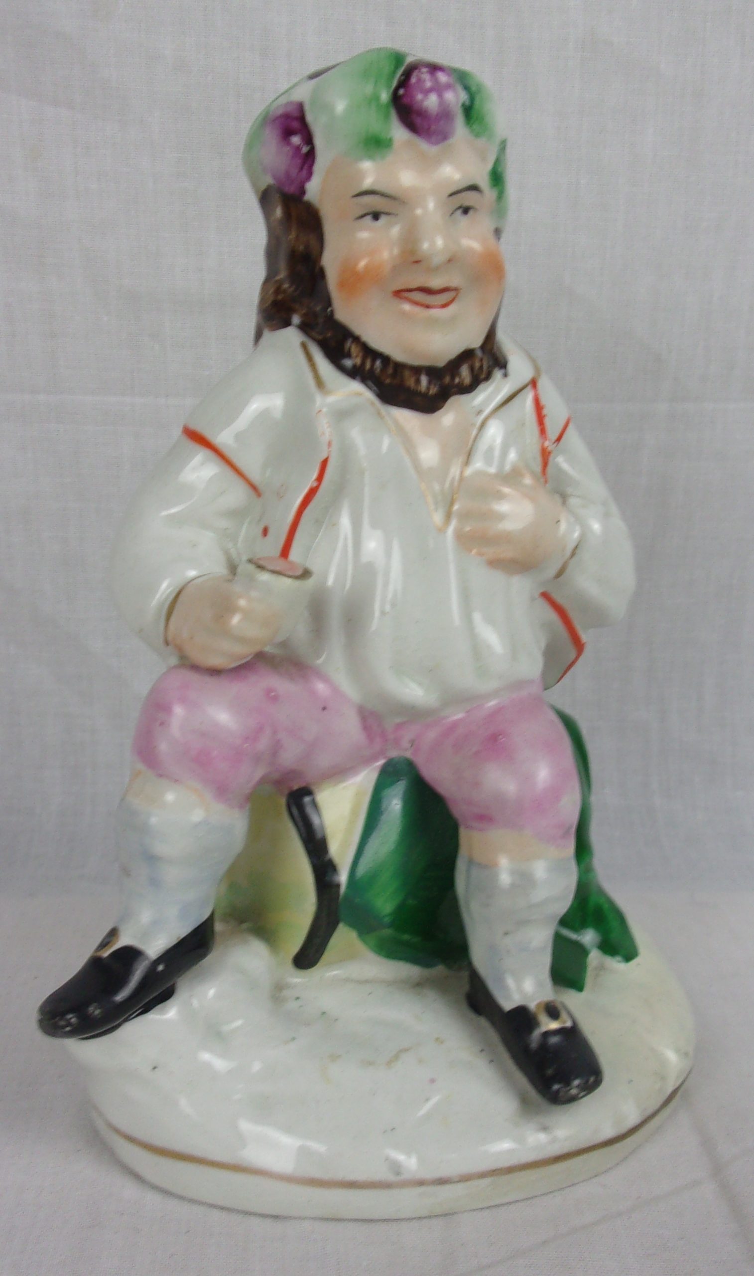 Mid 19th Century Staffordshire Figurine Of A Seated Gentleman Imbibing