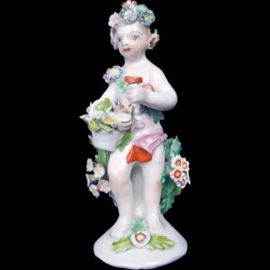 An English Bow Porcelain Figure Of A Putti Holding Basket With Flowers, c.1760