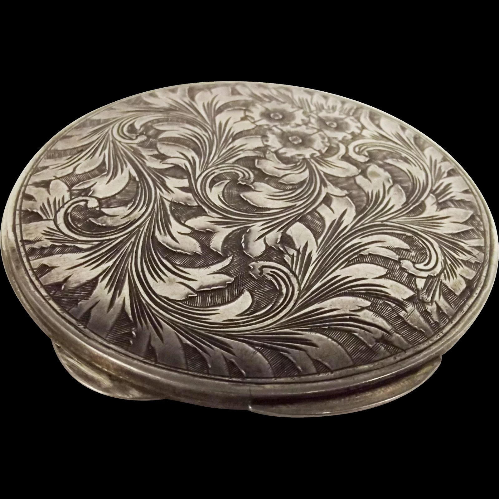 An Italian White Metal Ladies Compact With Floral Decoration