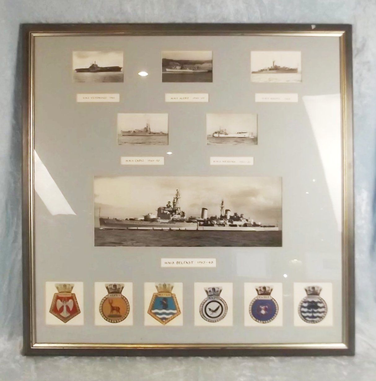 Framed Set of Photographs of Various Royal Navy Ships Including HMS Belfast
