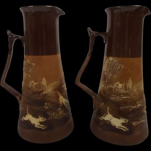 A Pair Of Circa 1910 Royal Doulton Stoneware Hunting Scene Ewers