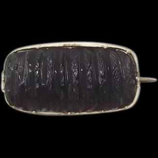 A Victorian Whitby Jet & 9 Ct Gold Brooch