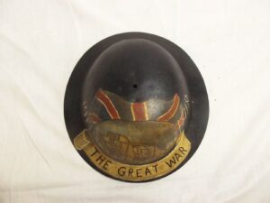 WWI British Raw Edge Brodie Helmet With Post War Painting Of A Tank To Commemorate The Great War