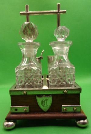 Silver Plated And Oak Cruet Set In The Manner Of Christopher Dresser
