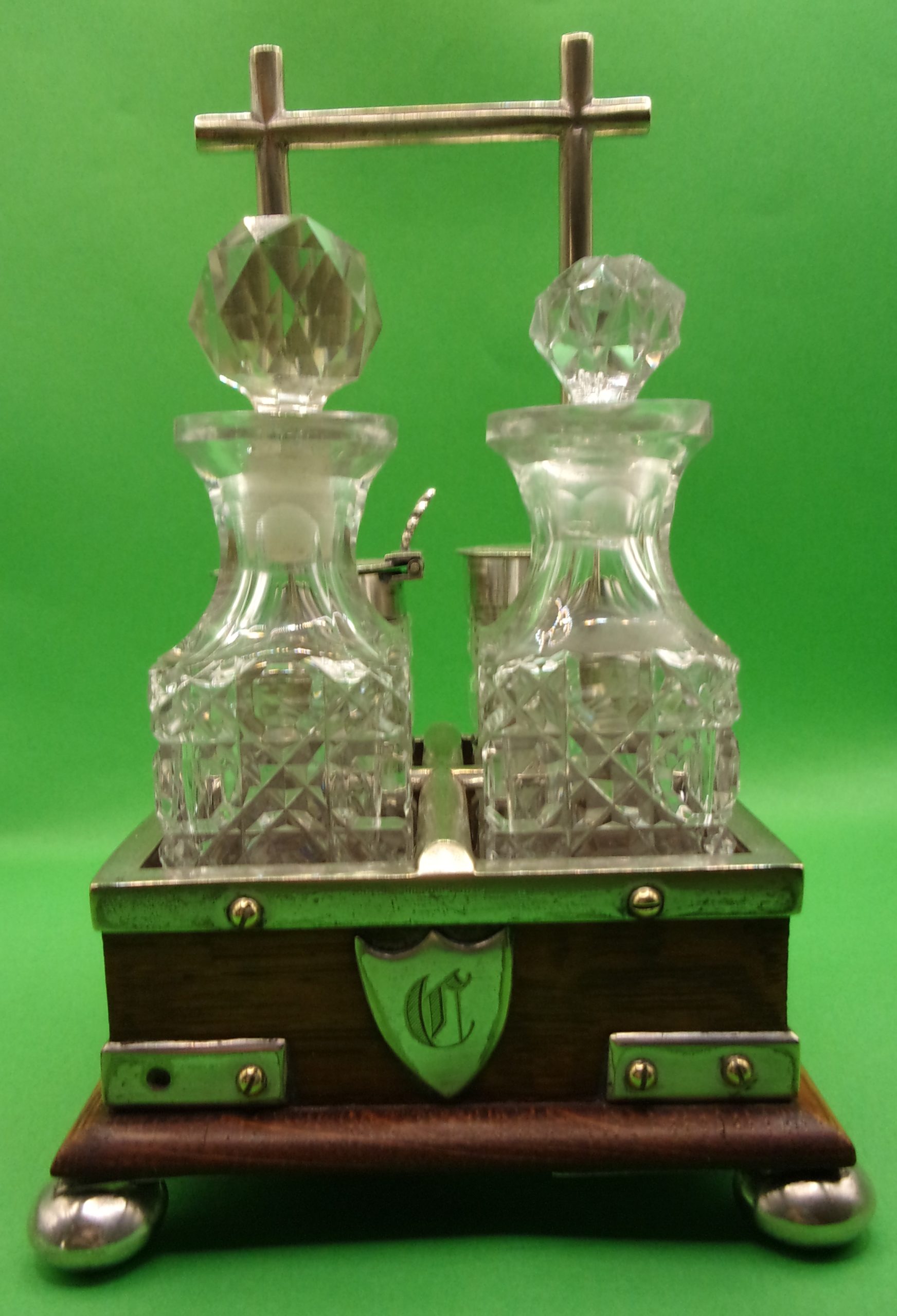 Silver Plated And Oak Cruet Set In The Manner Of Christopher Dresser