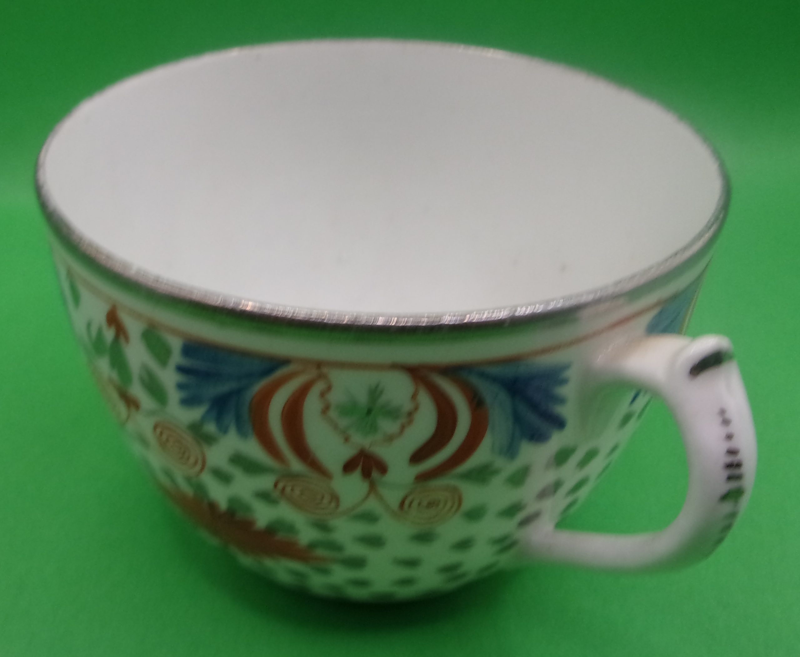 18th Century English Porcelain Teacup And Saucer In Polychrome Enamels With Silvering - Image 3