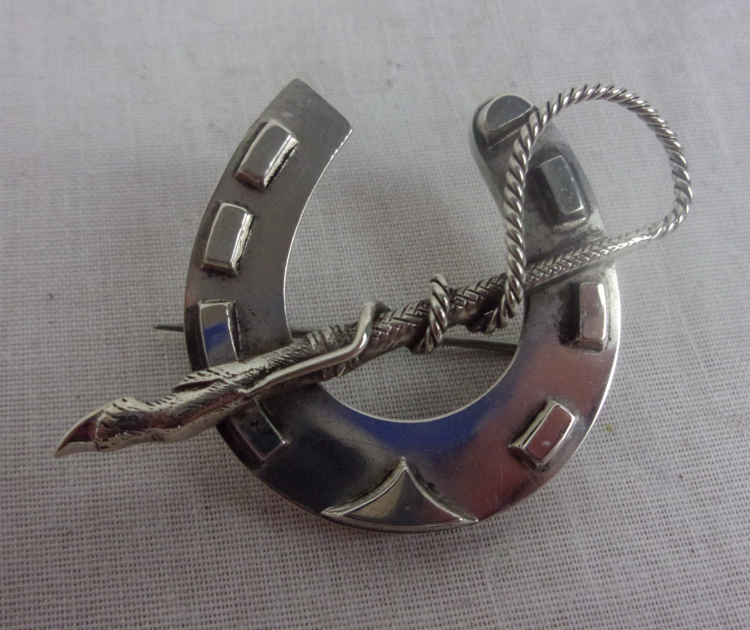 Silver Horse Shoe And Riding Crop Brooch
