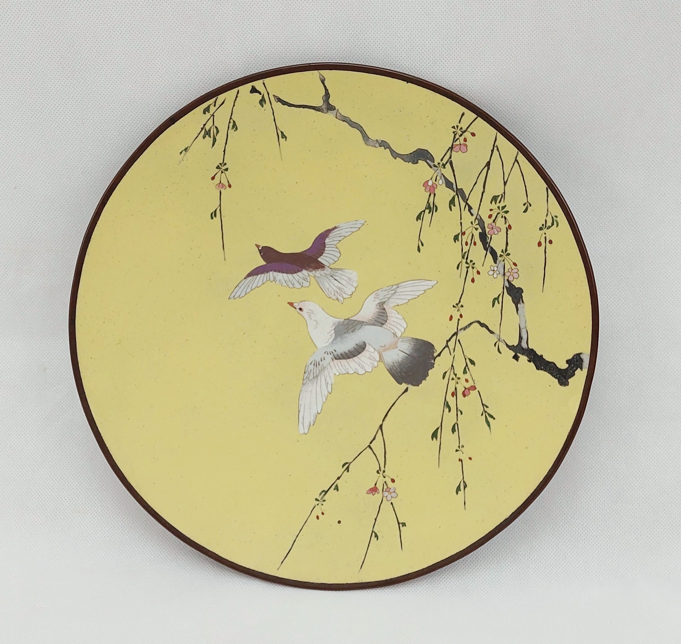 Japanese Imperial Yellow Ground Meiji Period Enamel Charger Depicting A Pair of Doves In Flight Amongst Cherry Blossoms