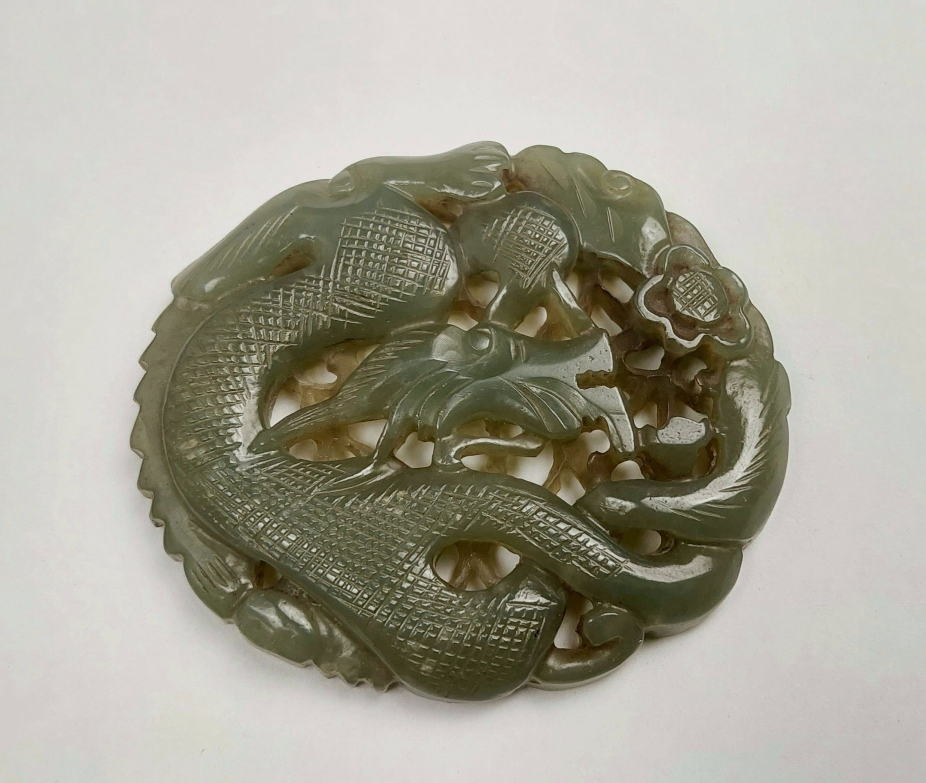 Ornately Carved Chinese Reticulated Deep Celadon Jade Pendant Of A Coiled Dragon