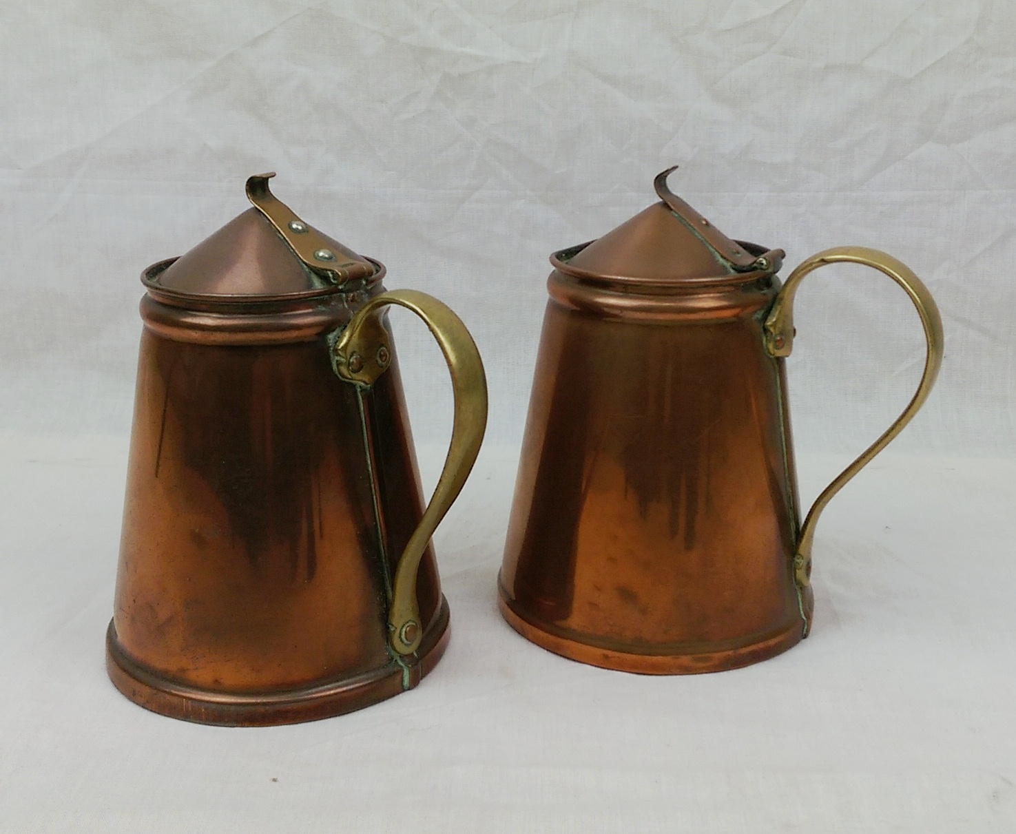 Pair Of Victorian Arts And Crafts Lidded Copper Insulated Hot Water Jugs By W.A.S. Benson