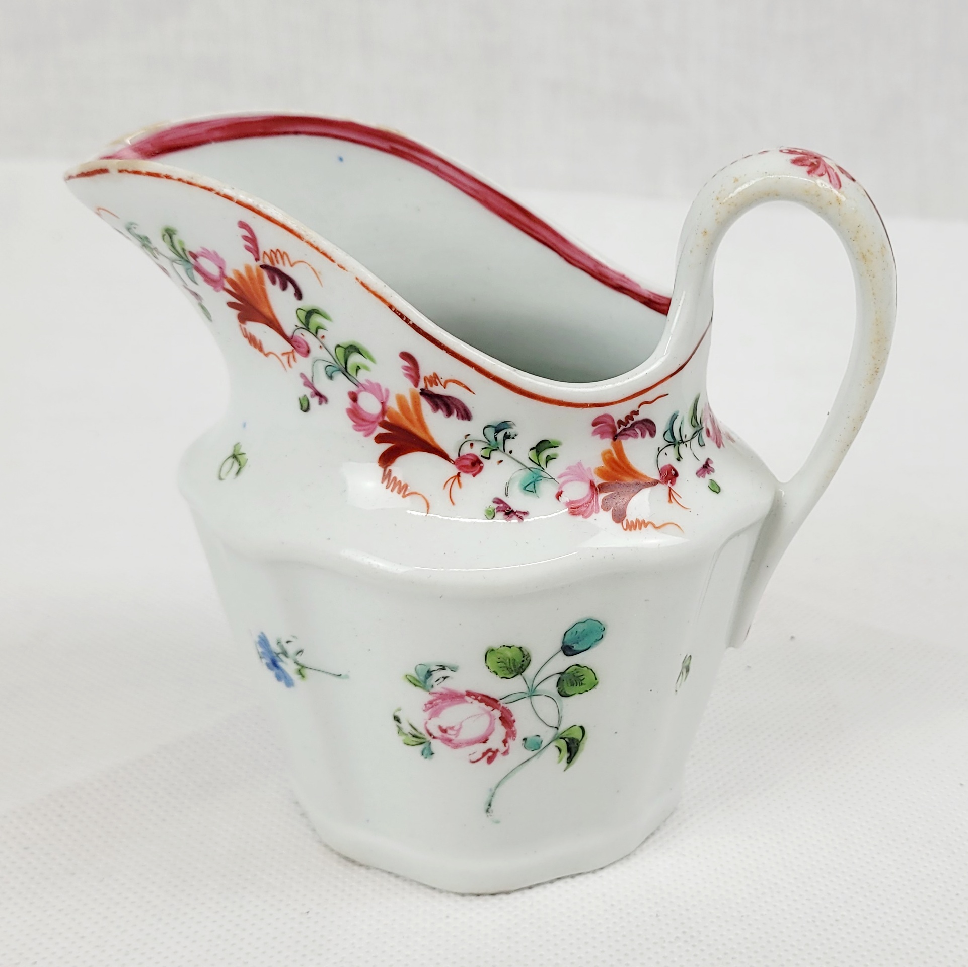 Circa 1790 New Hall Porcelain Cream Jug With Blue And Pink Flowers And Floral Garlands