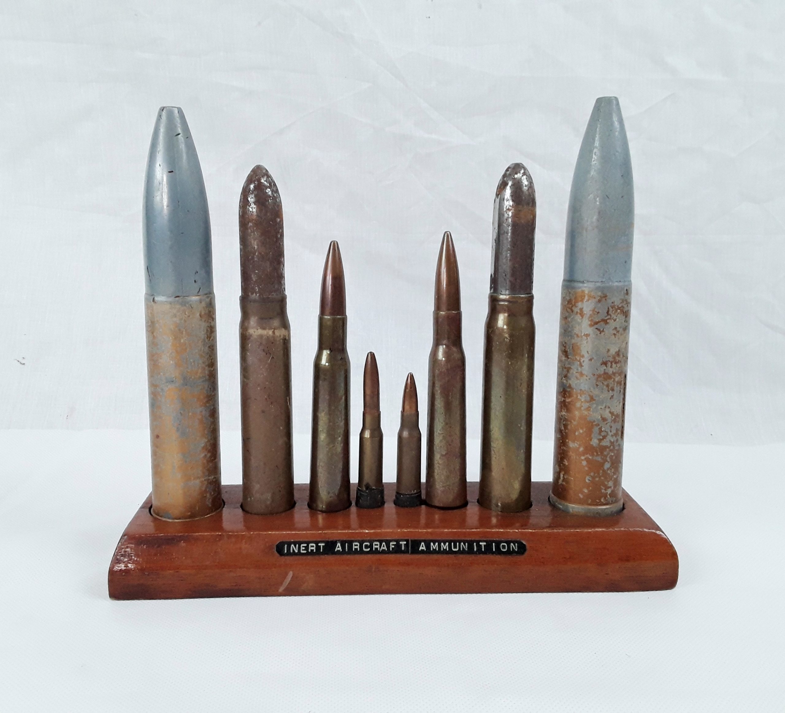 Mounted Display Of 8 Inert Aircraft Ammunition Rounds