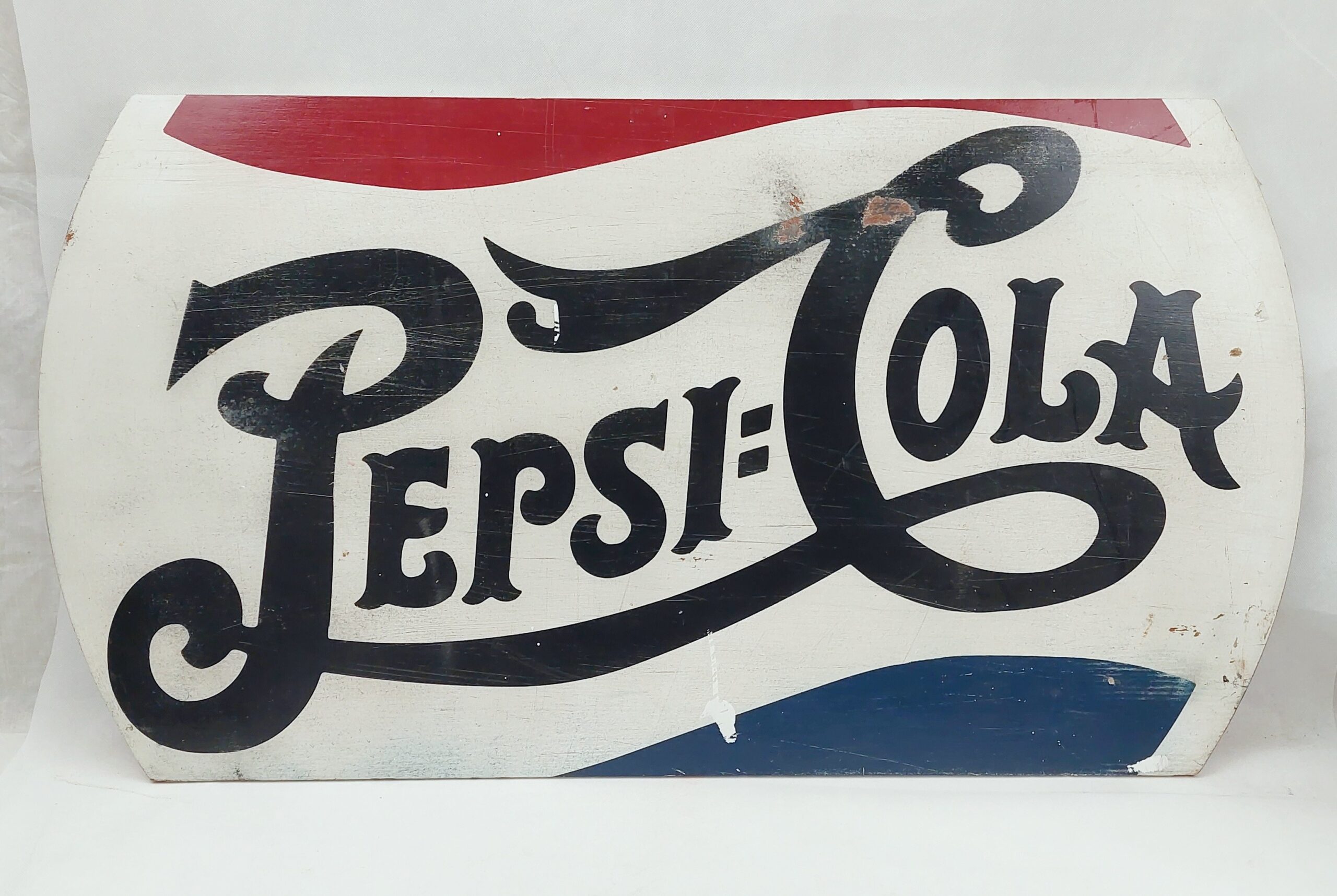 A Wooden Pepsi Cola Advertising Sign