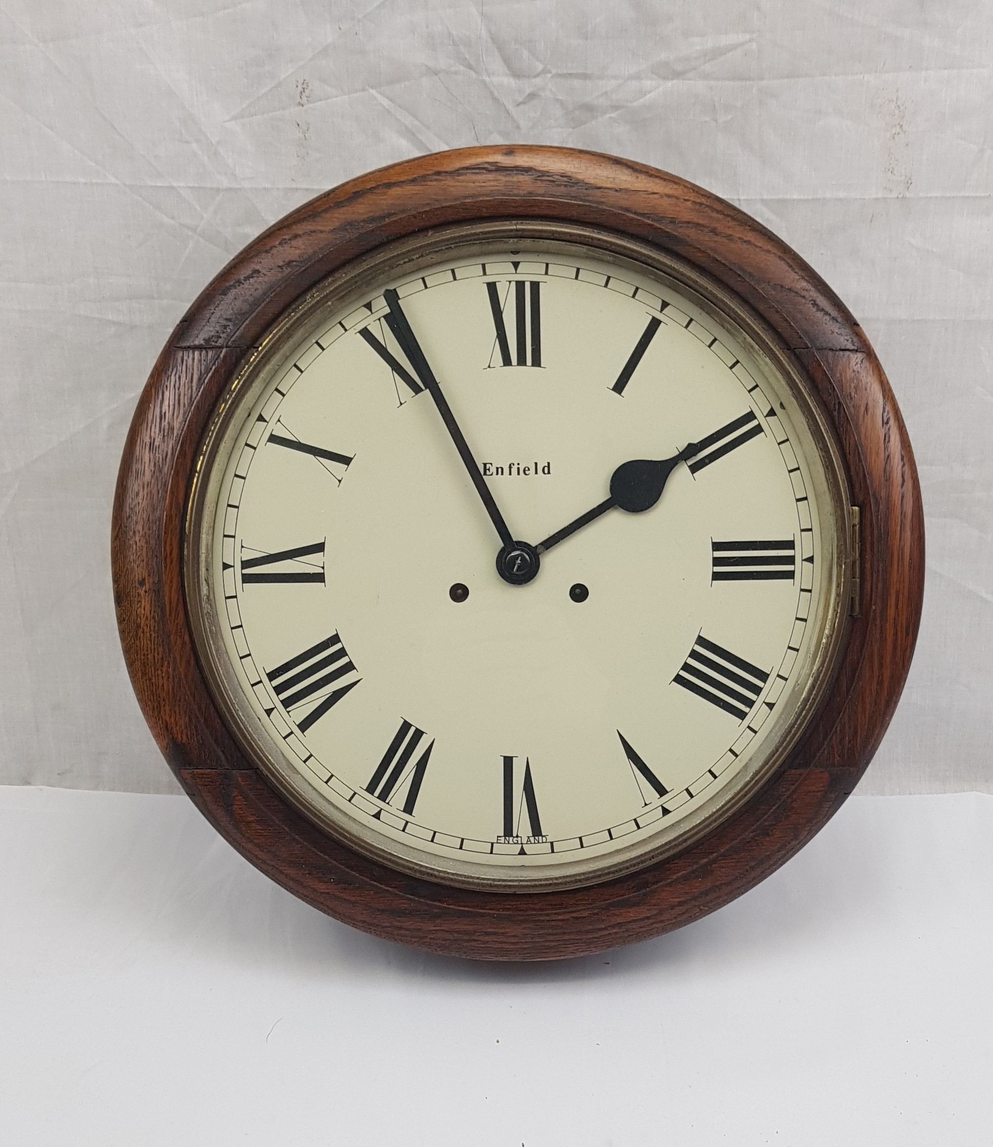 Circa 1920 Enfield Round Dial Striking Oak Wall Clock