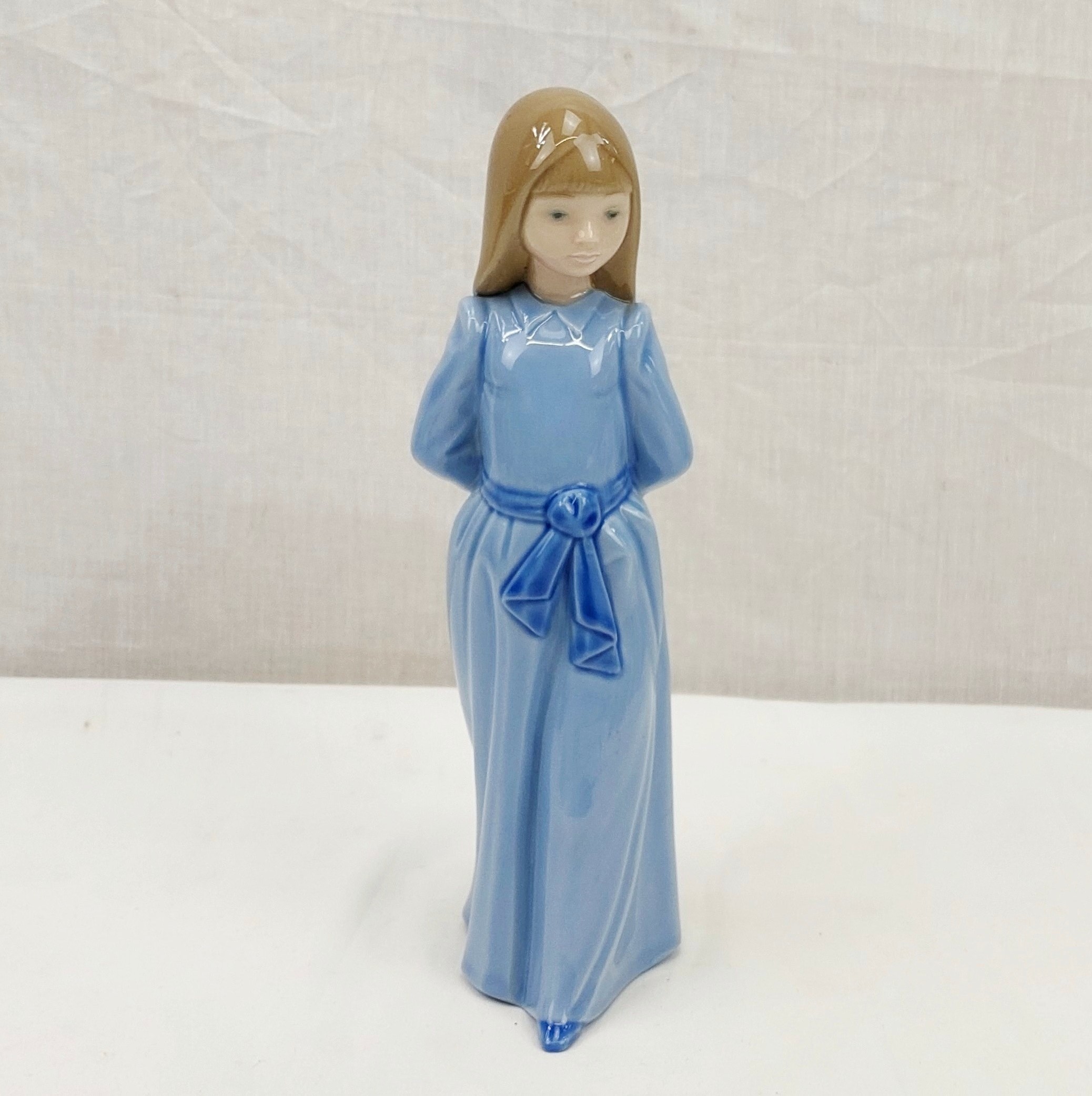 Lladro Nao Figurine #1425 ‘Girl In Blue Dress With Hands Behind Back’