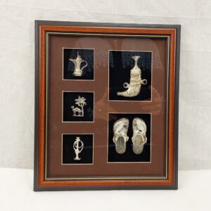Framed Display of Silver Arabic Items