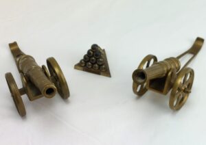 Pair of Miniature, Replica, Civil War Style, Brass Cannons, and a pile of Cannon Balls labelled Fort Pulaski, GA