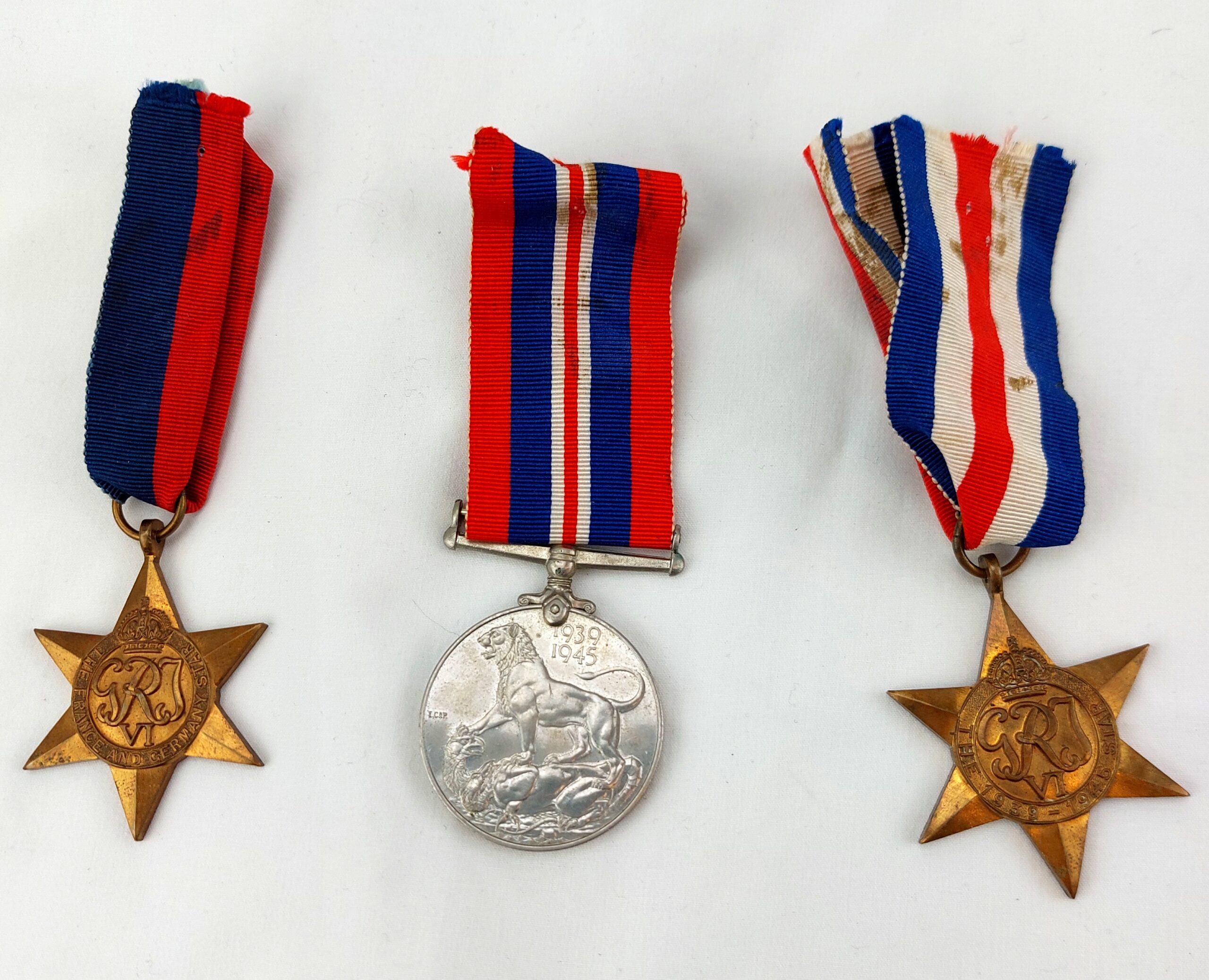 British, WW2, Medals and Service records for L.Cpl Leslie H.E. Hough, The France and Germany Star, The 1939-1945 Star, The WW2 War Medal 1939-1945, WW2 Issue letter for medals, Record of Service, The Hampshire Regt (36th & 7th Foot) Regimental History Booklet, Newspaper Clipping of Hampshire Reg't Wounded, EIIR Royal Military Police Blazer Badge, Soldier's Release Book Class A, National Registration Identity Card, Book of 12 B&W Photographs 1940-1944 Oostende - Image 2