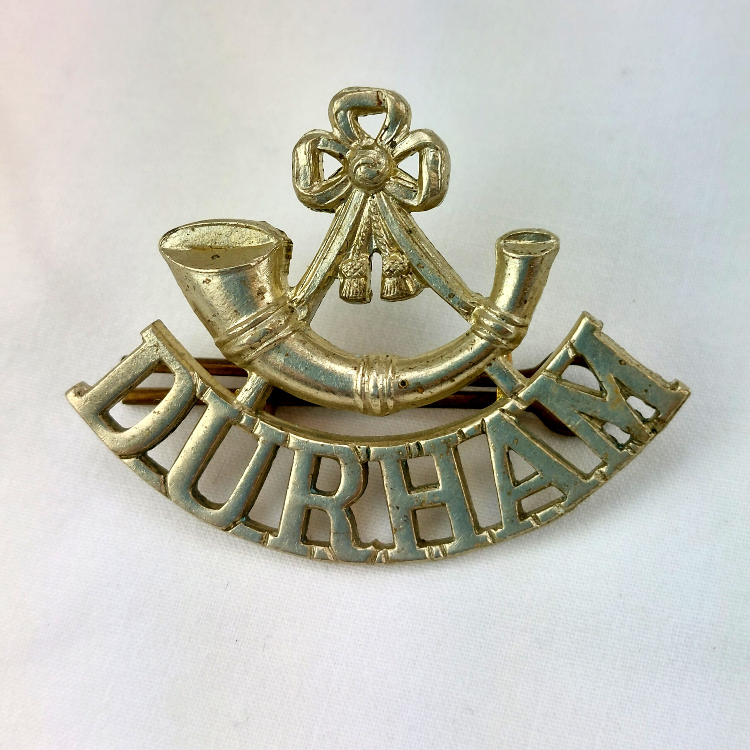 British, Durham Light Infantry White Metal Shoulder Title, Left Facing, Two Hexagonal Lugs