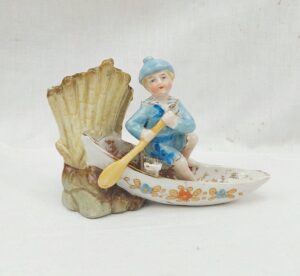 c1870 Bisque Porcelain Match Striker Of Boy In A Canoe