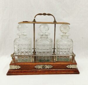 Edwardian Lockable Oak Tantalus With Three Cut Glass Decanters