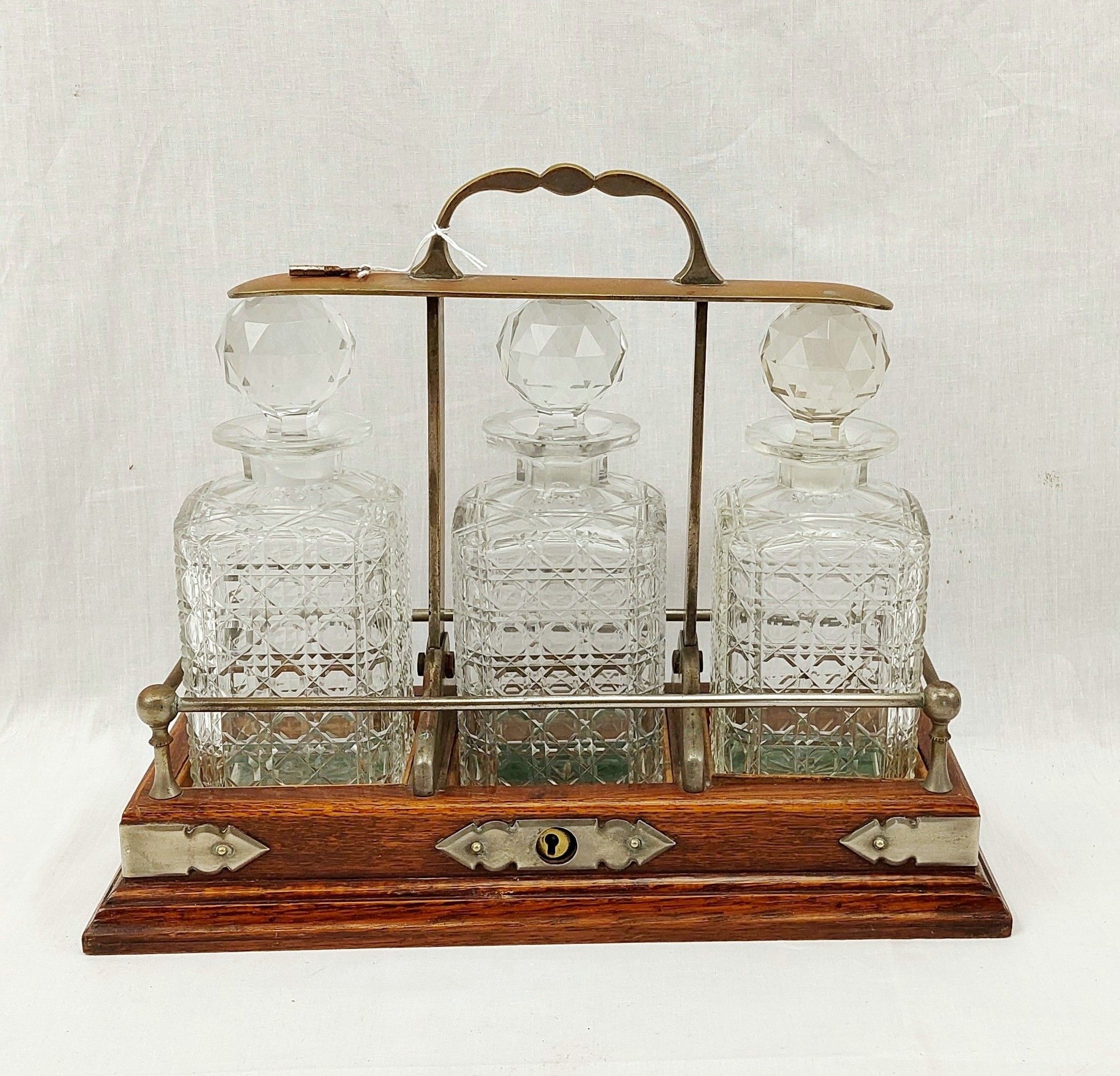 Edwardian Lockable Oak Tantalus With Three Cut Glass Decanters