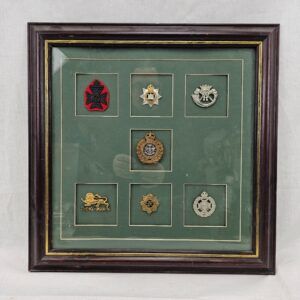 Framed Display Of 7 British Army Cap Badges