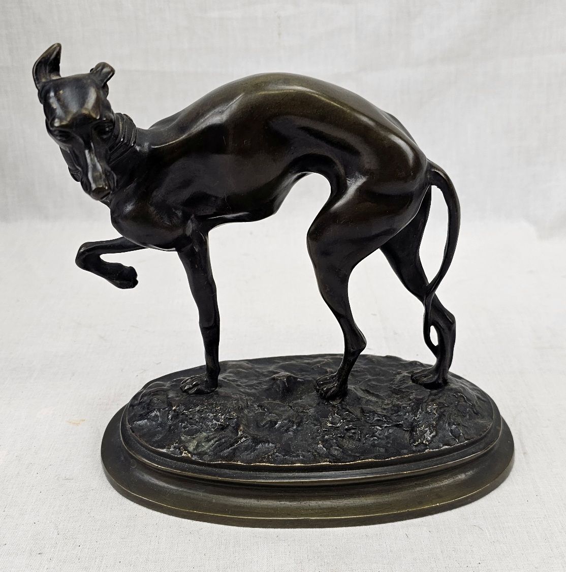 Early 20th Century Art Deco Bronze Greyhound In Full Aspect On A Stepped Oval Base