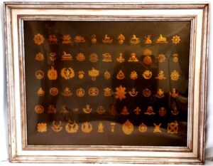 British, cWW1-WW2, Framed Display of 66 Original Brass & Gilding-Metal Army Cap Badges