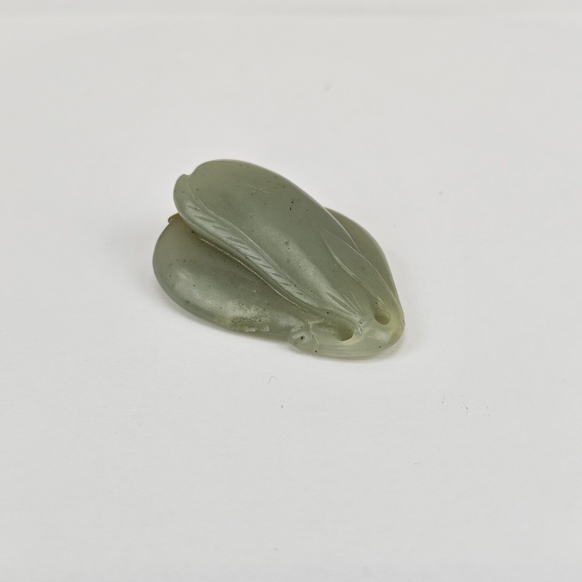Chinese Carved Celadon and Russet Nephrite Jade Pendant Double Peach Group, Qing Dynasty or Earlier