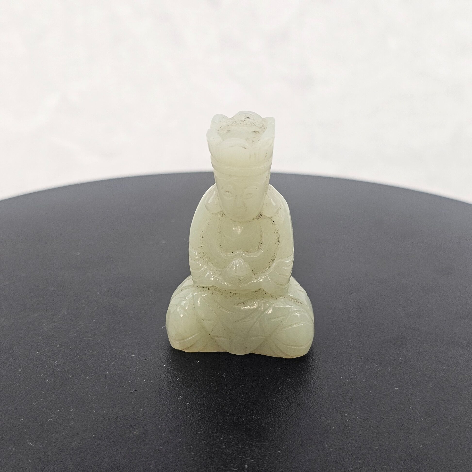 Chinese Qing Dynasty Pale Celadon Nephrite Jade Seated Crowned Deity Figure, 19th Century