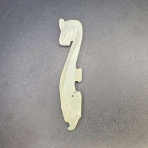 Chinese Pale Celadon Nephrite Jade Belt Hook in the Form of a Recumbent Dragon, Qing Dynasty, 18th to 19th Century