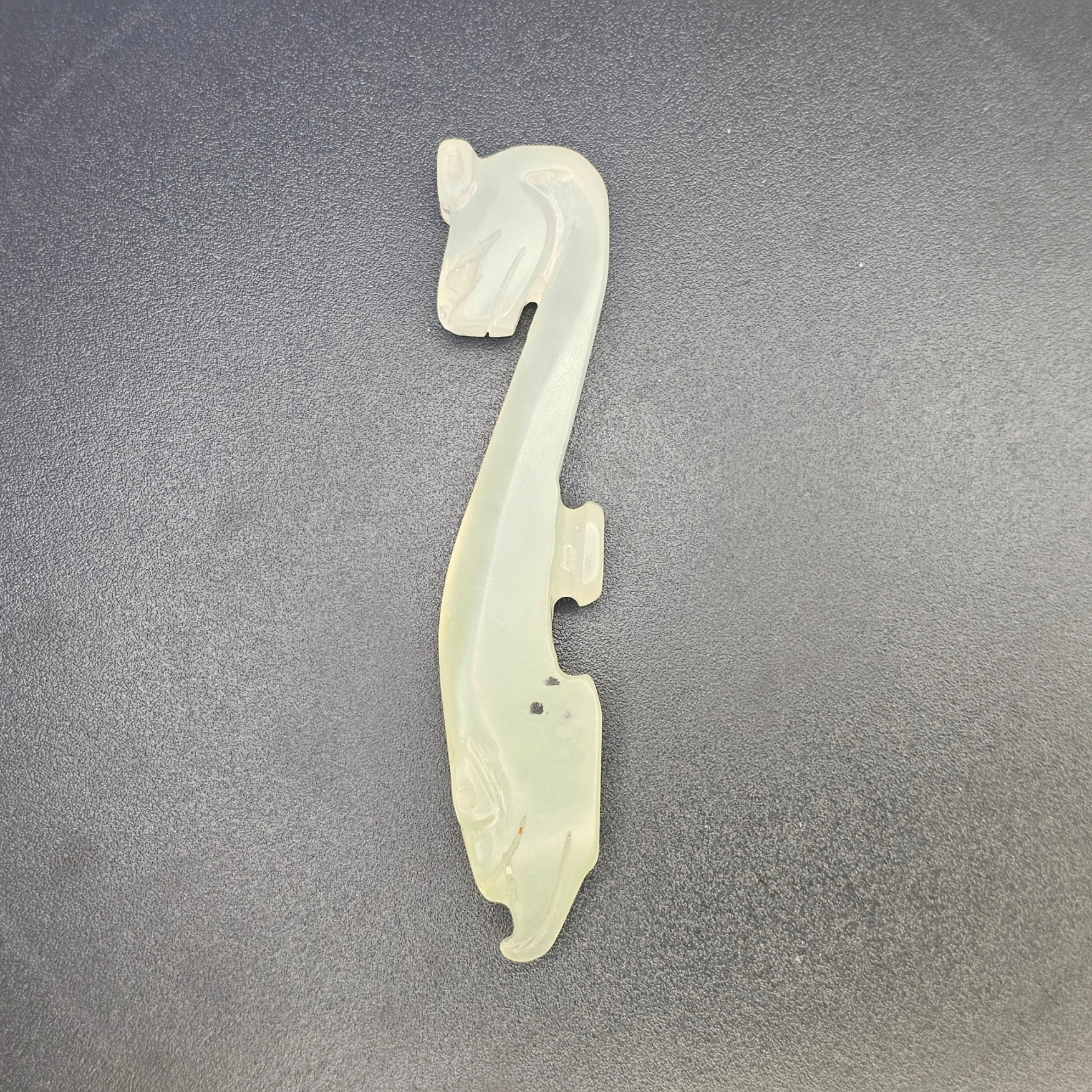 Chinese Pale Celadon Nephrite Jade Belt Hook in the Form of a Recumbent Dragon, Qing Dynasty, 18th to 19th Century