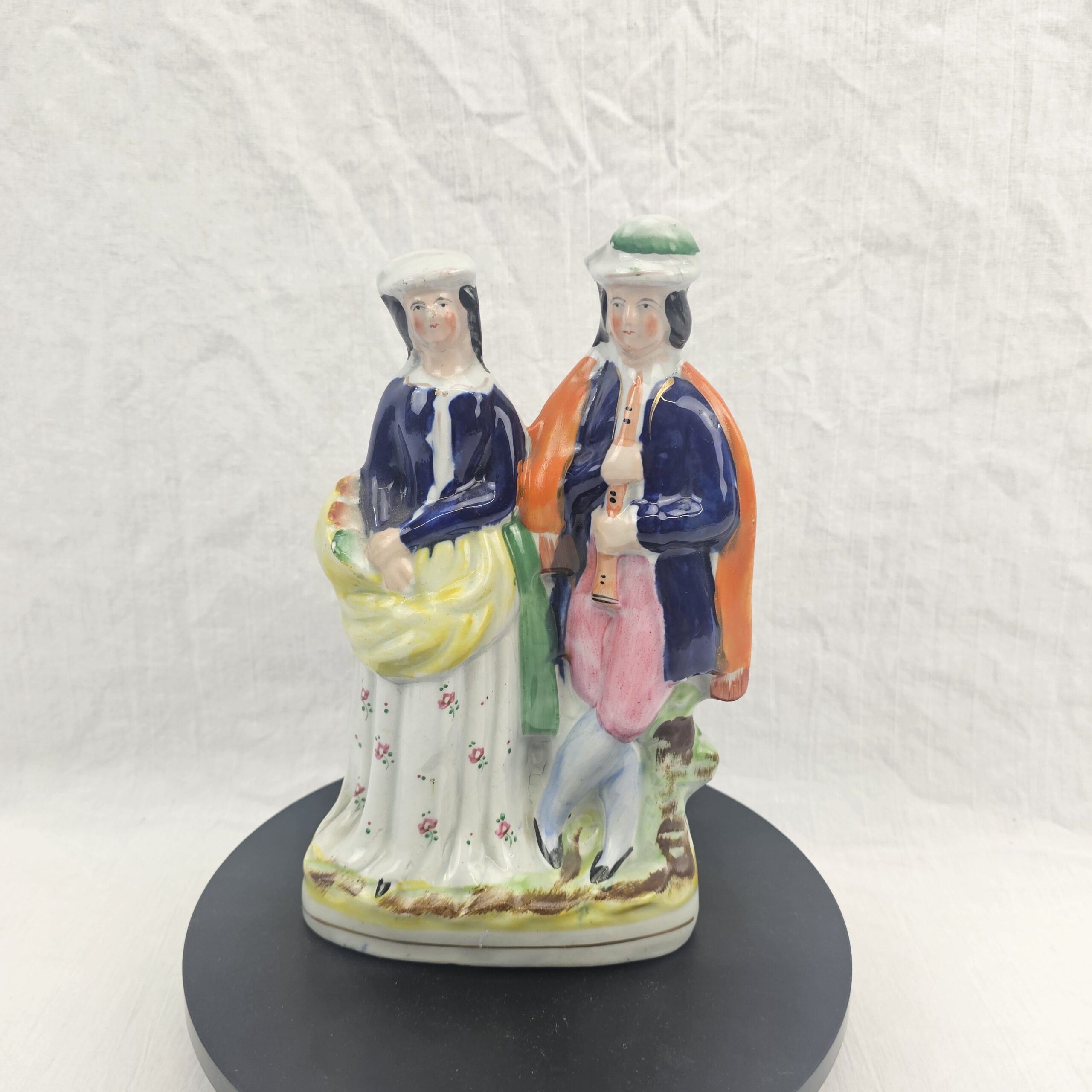 Victorian Staffordshire Figural Group of a Flautist and Flower Seller, c.1850–1870