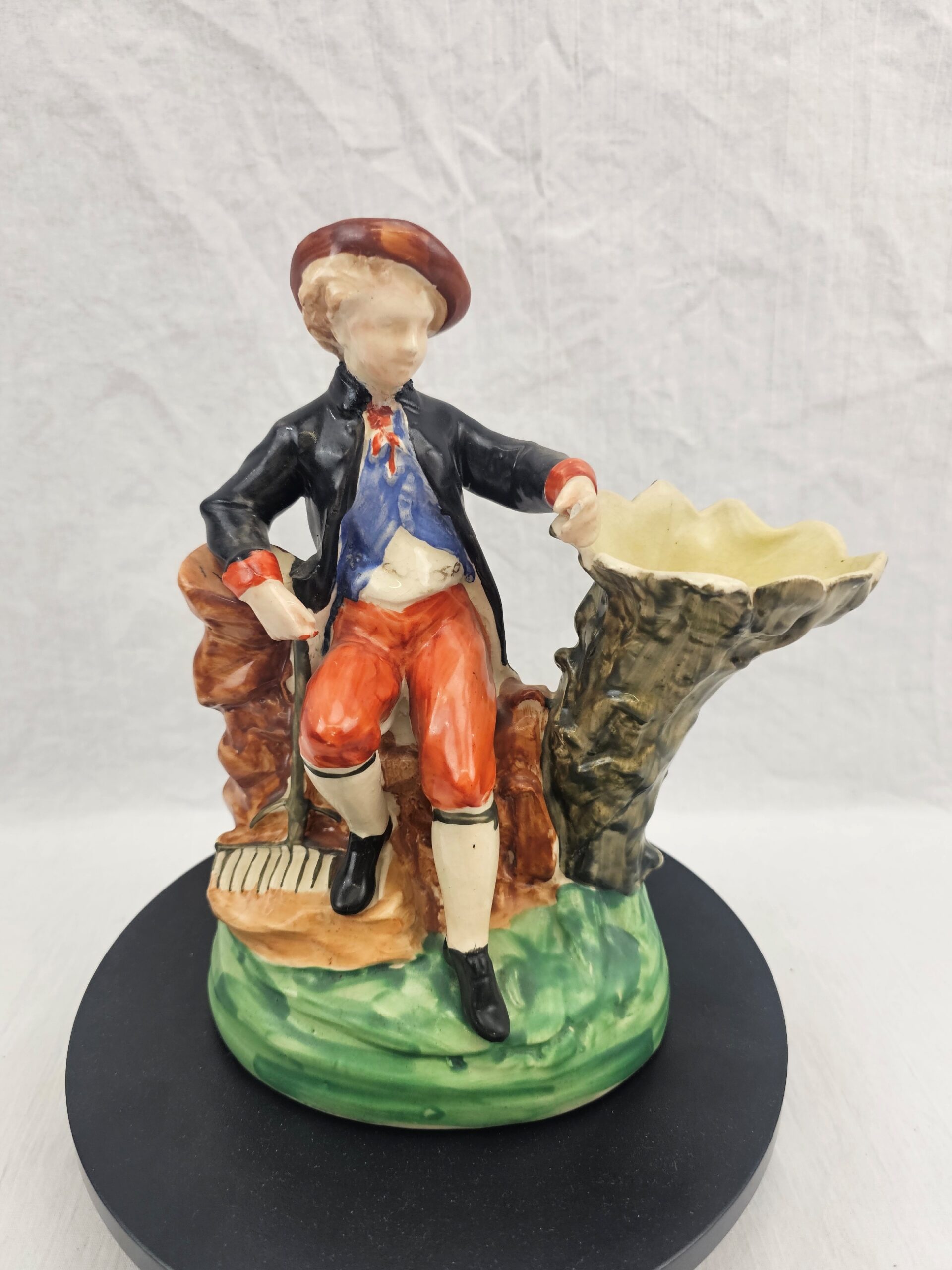 Victorian Staffordshire Earthenware Figural Spill Vase, Seated Youth in Pastoral Costume with Rake, circa 1850–1875